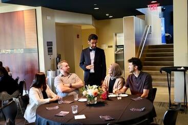 Moazzum Bajwa, MD, talks to student guests