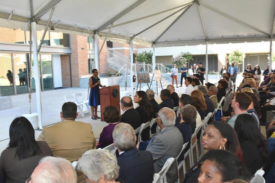 Deborah Deas addresses attendees at the Ribbon Cutting Ceremony